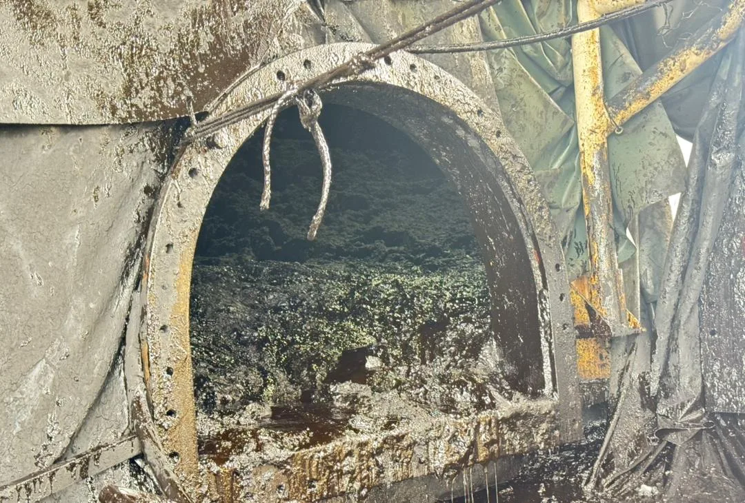 Thick industrial sludge inside equipment at a Malaysian refinery site