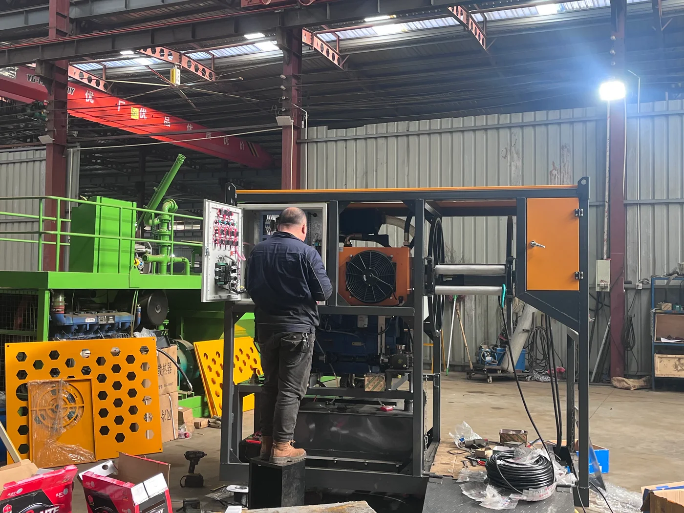 Technician assembling the control and hose reel system